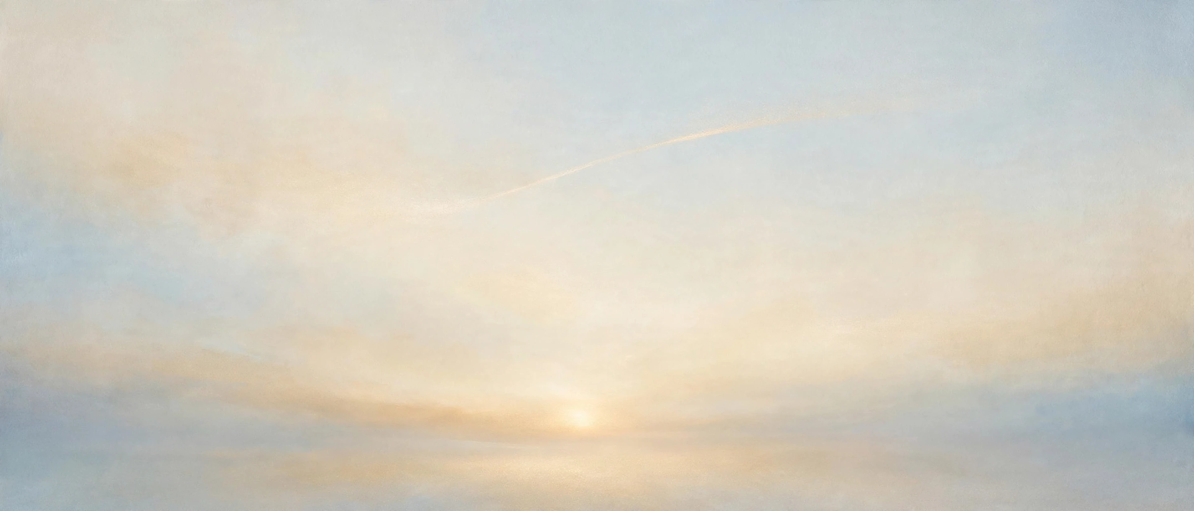 A quiet horizon glow beneath a vast sky